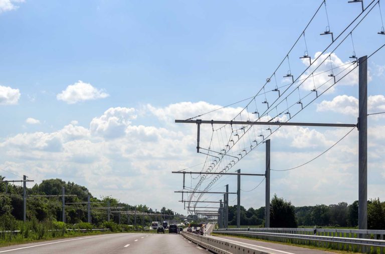 Picture of road with overhead electricity cables
